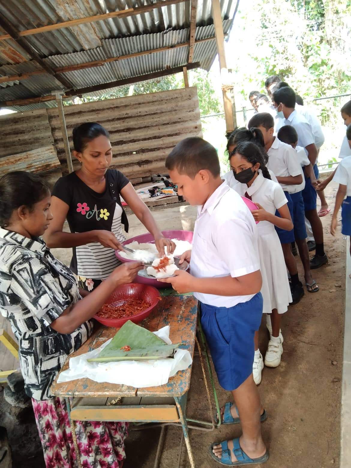 Children receiving school meals in rural Sri Lanka