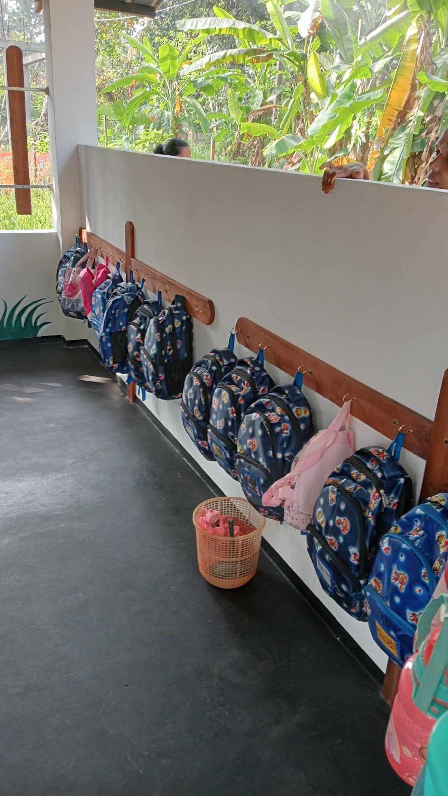 Students with donated school bags and stationery